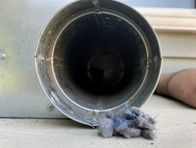 Rockland Dryer Vent Cleaning technician using specialized equipment to clear severe dryer vent blockage in Rockland